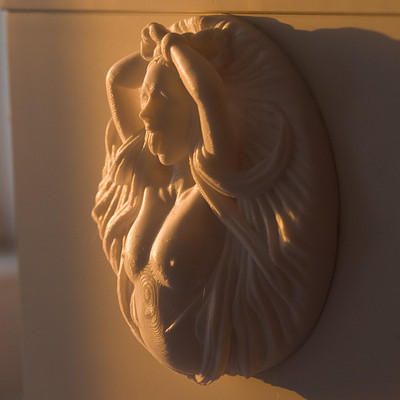 The image features a white statue of a woman with her hands on her head, possibly in the form of a decorative piece or a door knob. The statue is made from a material that resembles ceramic or porcelain, giving it an elegant and artistic appearance. The sunlight shines through a window onto the statue, casting light on its surface and creating interesting shadows around it.