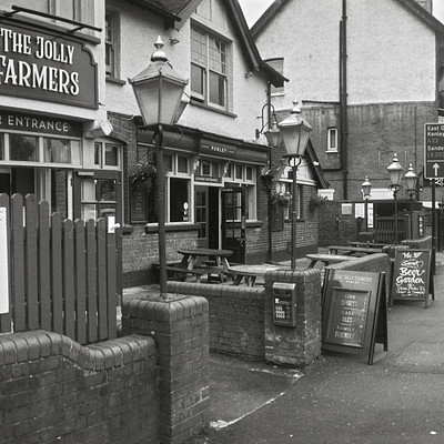 Jolly Farmers (#2024 #2024-07 #35mm-film #apx-100 #bars #film #horizont #july #lamps #monochrome #panoramas #ratio-3-7)